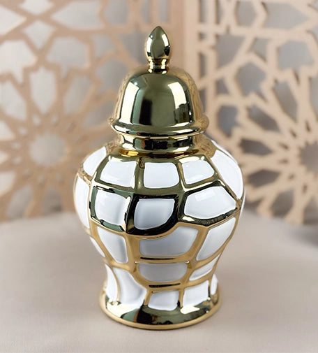 Noor decorative urn with a sleek, elegant design, featuring intricate detailing and a glossy finish, ideal for enhancing the aesthetic of any room.