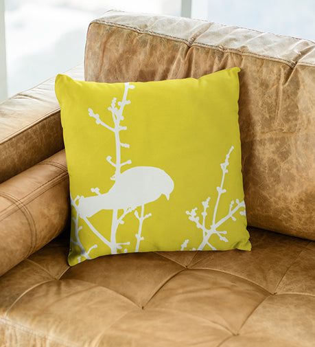 Sunbird Stylized Cushion featuring a vibrant, nature-inspired design with warm, uplifting tones.