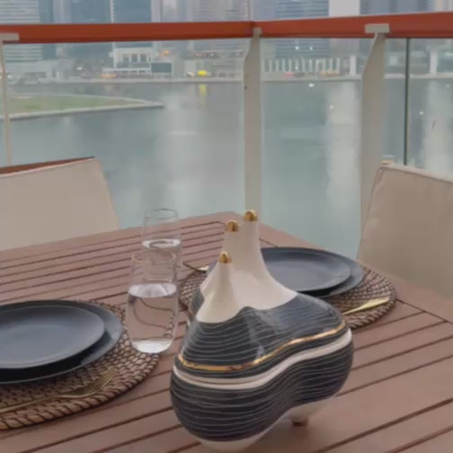 Powell Decorative Bowl with a sleek, modern design and refined finish, perfect for adding a stylish accent to any space.