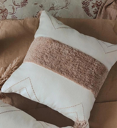 Handwoven cushion named 'Haze' with a textured fabric design.