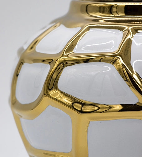 Noor decorative urn with a sleek, elegant design, featuring intricate detailing and a glossy finish, ideal for enhancing the aesthetic of any room.
